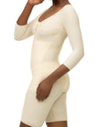 Beige shapewear garment worn by a model on a white background