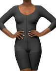 Black bodysuit worn by a model on a white background