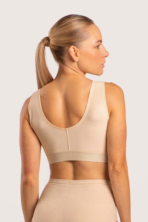 Isavela BR02 Stage 1 surgical bra featuring an integrated 2-inch elastic bust-line for stable breast augmentation and lift recovery, seamless beige medical fabric.
