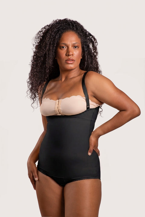 Isavela BS02 Stage 2 panty-length bodysuit with adjustable suspenders and zipper-free design for liposuction and tummy tuck recovery, seamless black medical fabric.
