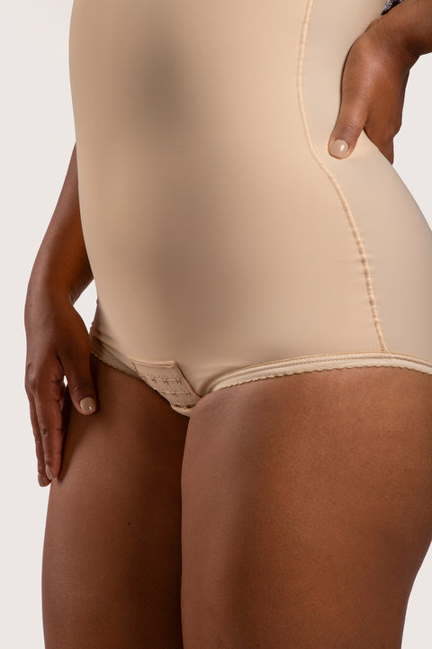 Close-up of the high-waist abdominal compression and hook-and-eye crotch closure on the BS02 bodysuit, showing the flat-seamed finish for skin safety.