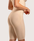 Rear view of the BE13 bodysuit in black, demonstrating the glute-lifting architecture and high-back support for optimal post-surgical contouring.