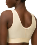Isavela BR02 Stage 1 surgical bra featuring an integrated 2-inch elastic bust-line for stable breast augmentation and lift recovery, seamless beige medical fabric.