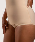 Close-up of the high-waist abdominal compression and hook-and-eye crotch closure on the BS02 bodysuit, showing the flat-seamed finish for skin safety.