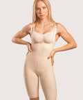 Isavela BS04 Stage 2 mid-thigh bodysuit with adjustable suspenders and zipper-free design for BBL and thigh liposuction recovery, seamless beige medical-grade fabric.