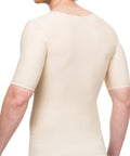 Man wearing a beige compression shirt on a white background
